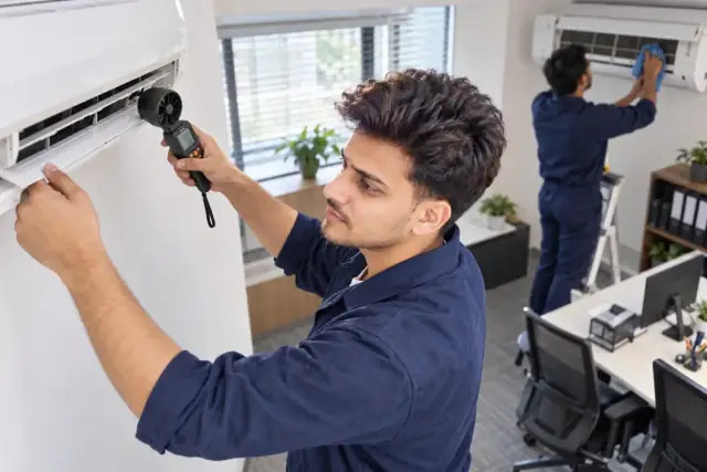 Technicians providing AC Maintenance